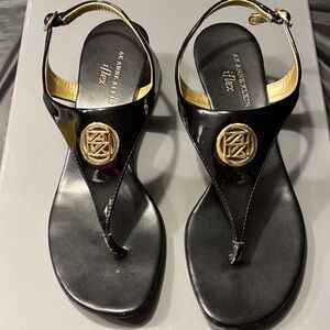 Anne Klein Glossy Black Sandals with Gold Emblem